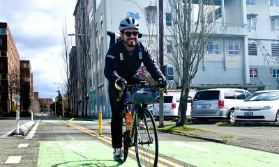 Tyler Vasquez rolls down the protected bike lane he helped create